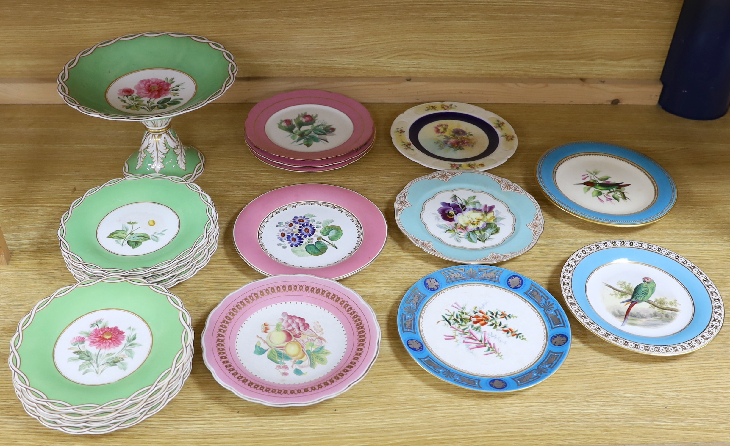 An English floral decorated comport and nine dessert plates, together with ten mixed floral patterned plates, largest 28cm in diameter